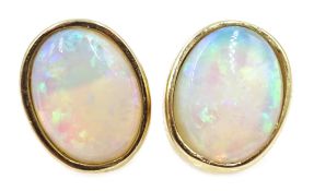 Pair of 9ct gold opal stud earrings, stamped 375 Condition Report approx 1.