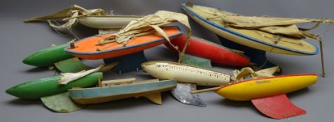 Collection of nine wooden pond yacht hulls, most with mast and sails, some bearing Star Yacht mark,