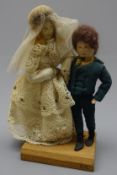 Edith Russell group of two Dickensian dolls with painted facial features and soft bodies,