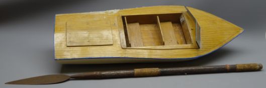 Battery powered model speedboat with blue and white painted wooden hull, simulated planked deck,