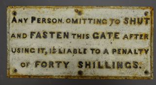 Cast iron railway sign of oblong form in black and white ' Any person Omitting to Shut and Fasten