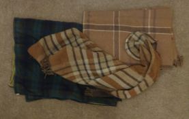 Early 20th century tartan patterned motoring rug with metal neck fitting collar and indistinct