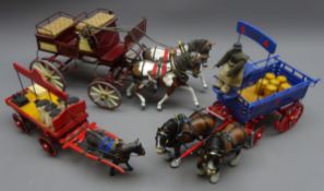 Three metal models of horse drawn vehicles by R.