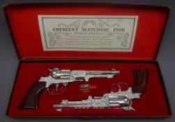 Crescent Matching Pair of Rustler Texan cap firing revolvers,
