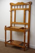 Solid pine hall stand, raised back, four pegs, rectangular mirror, hinged compartment,