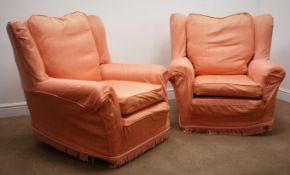 Pair wingback armchairs, upholstered in a salmon material,