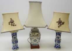 Pair of 20th century Chinese blue and white table lamps painted with panels of precious objects on