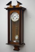 Late 19th century walnut and ebonised Vienna wall clock with broken arched pediment over a single