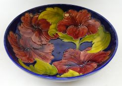 Moorcroft Hibiscus pattern fruit bowl on blue ground, blue signature and impressed marks to base,