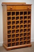 Oregon pine forty eight bottle wine rack, raised back, single drawer, shaped plinth base, W78cm,