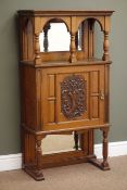 Edwardian oak side cabinet, moulded top, bevel edge mirror back with turned supports,