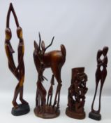 Four African hardwood sculptures, three figural pieces and family of Antelope,