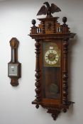 Late 19th century walnut cased Vienna wall clock with moulded eagle finial on stepped pediment over