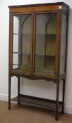 Edwardian inlaid mahogany display cabinet, two doors enclosing two lined shelves,