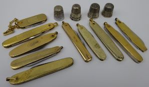 Ten rolled gold pen knives, one stamped 10k, Sterling silver thimble,