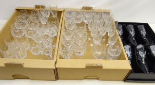 Matched suite of cut glass drinking glasses including champagne, tumblers, brandy and others,