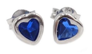 Pair of 9ct white gold blue stone, heart shaped stud earrings,