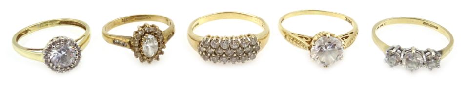 Four 14ct gold cubic zirconia dress rings and a 9ct gold cubic zirconia cluster ring,
