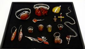 Two contemporary large silver amber hinge bangles, amber pendants, rings and earrings,