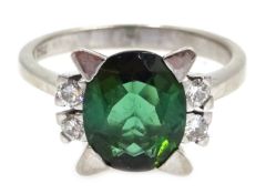18ct white gold oval green tourmaline and four stone diamond ring,