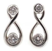 Pair of 9ct white gold diamond pendant earrings,