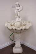 Painted composite stone fountain,