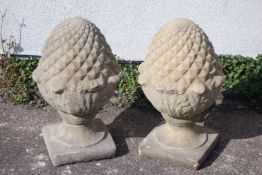 Pair of composite stone pineapple gatepost finials, H56cm,