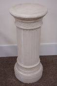Composite classical style stone column with reeded sides, circular plinth base,