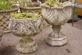 Two circular composite stone garden urns,