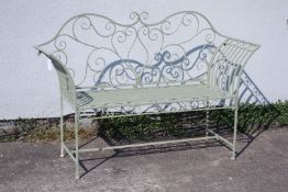 Green painted open work wrought metal garden bench,