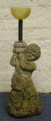 Composite stone figure of boy carrying on pot on his shoulder,