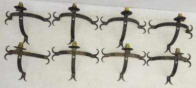 Set of eight wrought iron Gothic style wall lights,