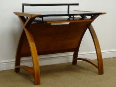 Contemporary walnut finish bent plywood desk with black glass top and keyboard slide, W90cm, H84cm,