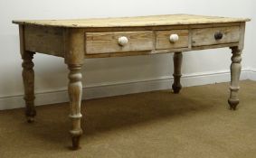 Stripped pine rectangular farmhouse style table, three drawers turned supports (W157cm, H72cm,