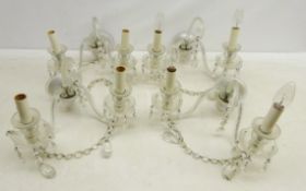 Set of four Venetian style two branch wall lights with central scroll stem,