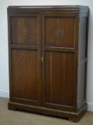 Early 20th century oak fitted gentleman's wardrobe, two panelled door enclosing fitted interior,