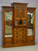 Edwardian walnut triple combination wardrobe, projecting cornice, carved foliage frieze,