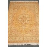 Fine Tabriz (300npsi) beige ground rug, central medallion with repeating border,