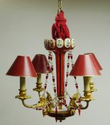 Four light gilt metal electrolier with cranberry white overlay lustre column and matching faceted