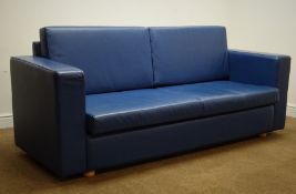 Three seat sofa upholstered in a blue leatherette fabric, bun feet,