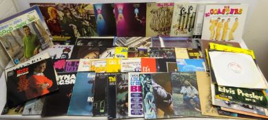 Sixty-four vinyl LP's, mainly 1960s including The Beatles,