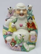 20th century Chinese ceramic model of Budai laughing and surrounded by adoring youngsters,