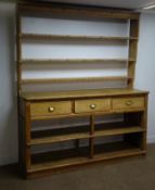 19th century pine dresser, three shelf plate rack, three drawers,