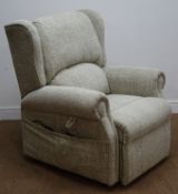 Electric reclining armchair, upholstered in a stone wash fabric,