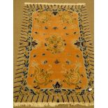 Chinese pink and blue ground wool rug, field of dragons, repeating border,