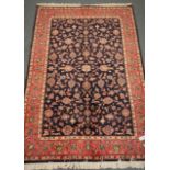 Kashan blue ground rug, floral field, repeating border,