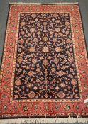 Kashan blue ground rug, floral field, repeating border,