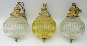Set of three matching moulded glass light fittings with foliate cast fittings,
