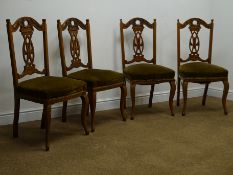Set of four Edwardian oak salon chairs, shaped, carved and pierced cresting rail and splat,