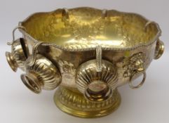 Silver-plated pedestal punch bowl, gadroon shaped rim with two lion mask ring handles and six cups,